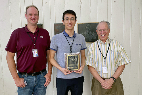 Xiaomin Chen, center, a 2022 recipient of the MSU Northern Gulf Institute Research Award