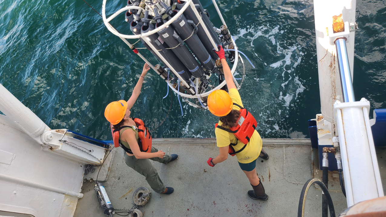 r. Jill Tupitza and doctoral student Allison Noble collect near-bottom water